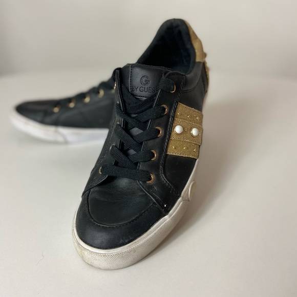 black and gold guess shoes